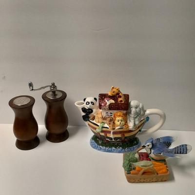 Decorative Noah's Ark Tea pot, Wooden salt & pepper mills, and a Blue Jay figure stealing vegetables.