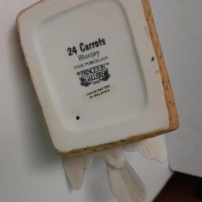 Decorative Noah's Ark Tea pot, Wooden salt & pepper mills, and a Blue Jay figure stealing vegetables.