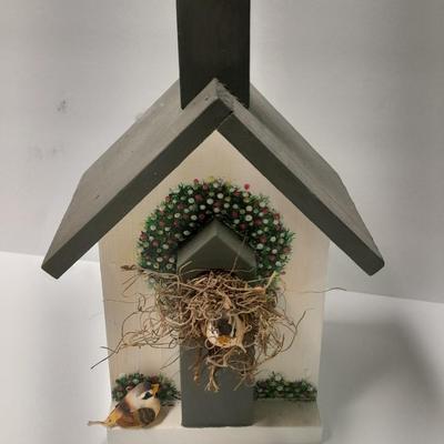 Two wooden bird house decorations
