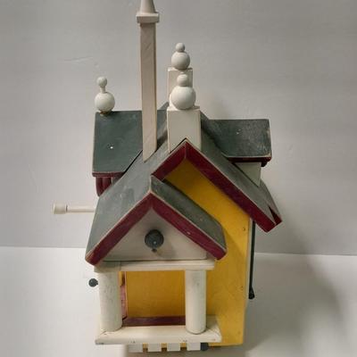 Birdhouse with small bird