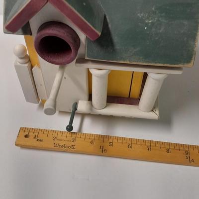 Birdhouse with small bird