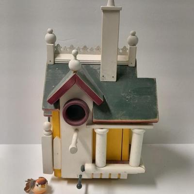 Birdhouse with small bird