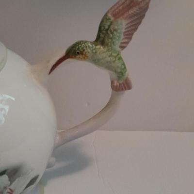 Music box Tea pot teacups with saucers and a tea diffuser