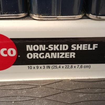 Nonskid Shelf organizer with metal cans of cooking spices