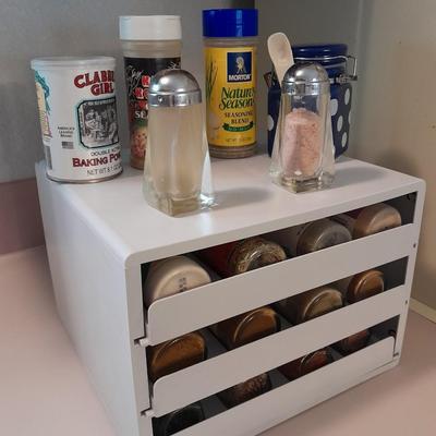 Plastic drawered Spice organizer with glass bottles of Spices