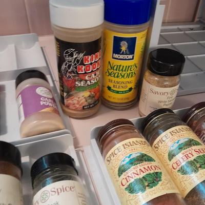 Plastic drawered Spice organizer with glass bottles of Spices