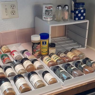 Plastic drawered Spice organizer with glass bottles of Spices