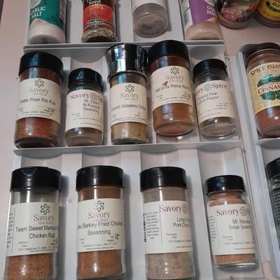 Plastic drawered Spice organizer with glass bottles of Spices