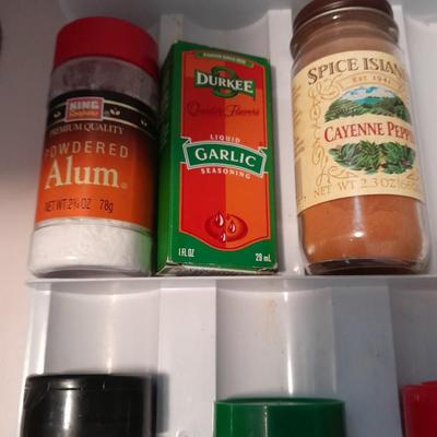 Plastic drawered Spice organizer with glass bottles of Spices