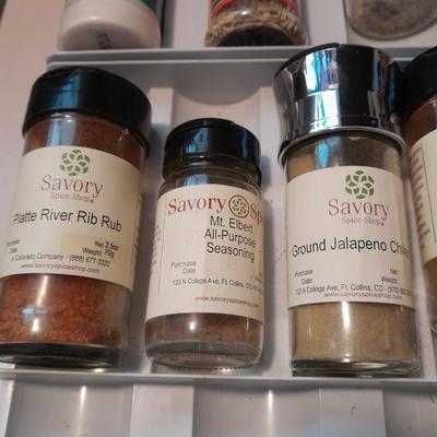 Plastic drawered Spice organizer with glass bottles of Spices