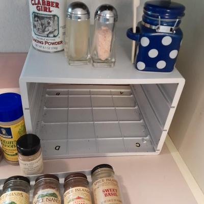 Plastic drawered Spice organizer with glass bottles of Spices