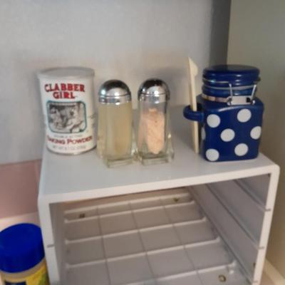Plastic drawered Spice organizer with glass bottles of Spices
