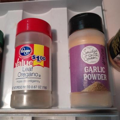 Plastic drawered Spice organizer with glass bottles of Spices