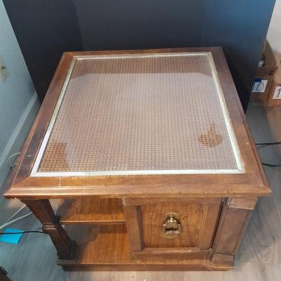 Square end table with glass top and woven / wicker design. (2)