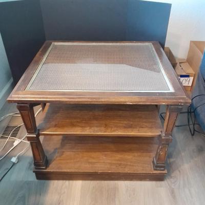 Square end table with glass top and woven / wicker design. (2)