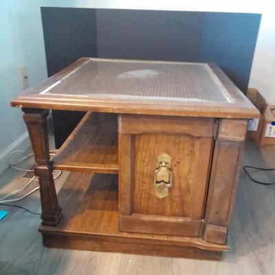 Square end table with glass top and woven / wicker design. (2)