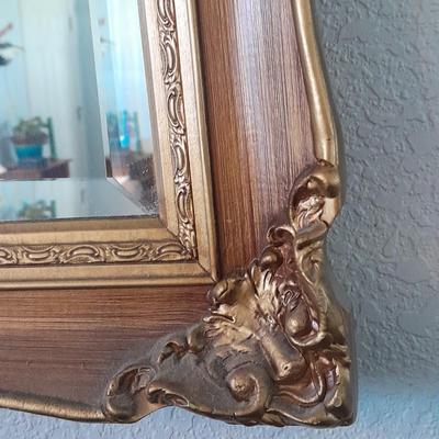 Large Gold framed beveled mirror with two MCM wall shelves.