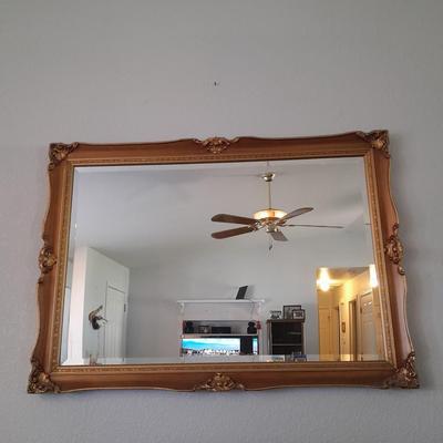 Large Gold framed beveled mirror with two MCM wall shelves.