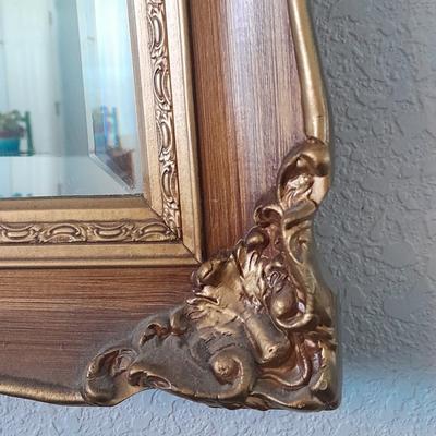 Large Gold framed beveled mirror with two MCM wall shelves.