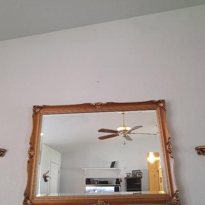Large Gold framed beveled mirror with two MCM wall shelves.