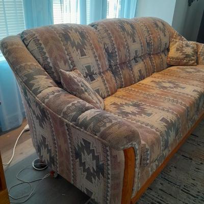 The Loren Mitchell Collection Southwestern style sofa with wood trim front