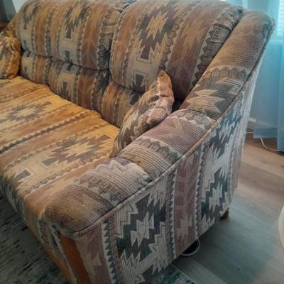 The Loren Mitchell Collection Southwestern style sofa with wood trim front