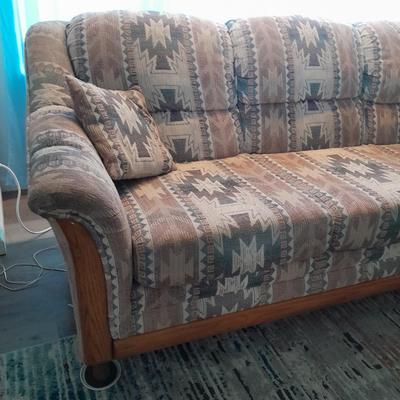 The Loren Mitchell Collection Southwestern style sofa with wood trim front