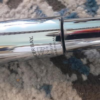 Vick's Humidifier, Glacier Bay shower head, and an electric heating pad