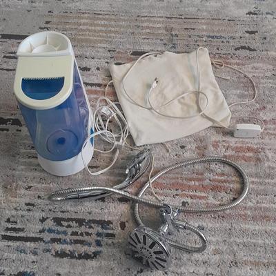 Vick's Humidifier, Glacier Bay shower head, and an electric heating pad