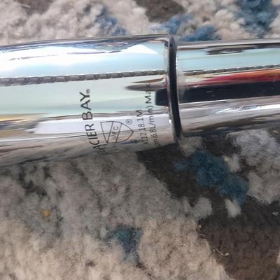 Vick's Humidifier, Glacier Bay shower head, and an electric heating pad