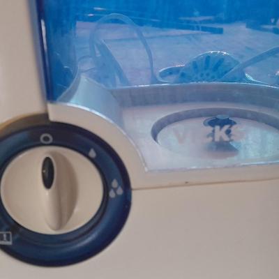 Vick's Humidifier, Glacier Bay shower head, and an electric heating pad