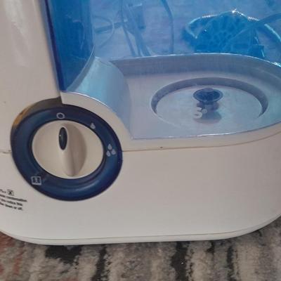 Vick's Humidifier, Glacier Bay shower head, and an electric heating pad