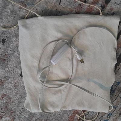 Vick's Humidifier, Glacier Bay shower head, and an electric heating pad