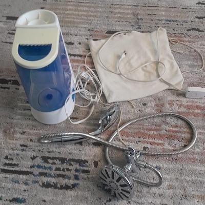 Vick's Humidifier, Glacier Bay shower head, and an electric heating pad