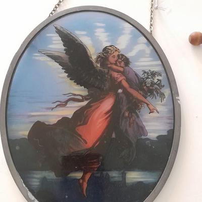 Stained glass window hangings and a small God bless the birds Tapestry.