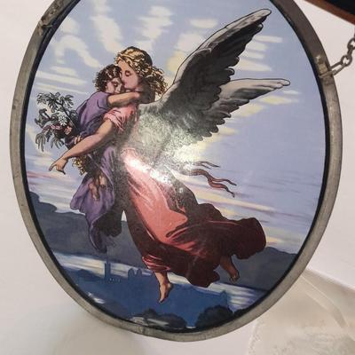 Stained glass window hangings and a small God bless the birds Tapestry.