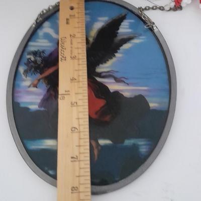 Stained glass window hangings and a small God bless the birds Tapestry.