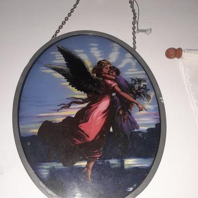 Stained glass window hangings and a small God bless the birds Tapestry.