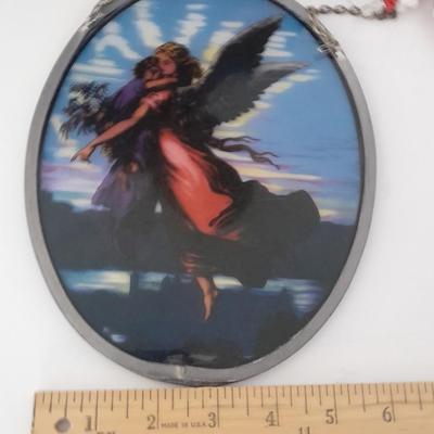 Stained glass window hangings and a small God bless the birds Tapestry.