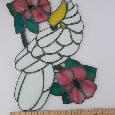 Stained glass window hangings and a small God bless the birds Tapestry.