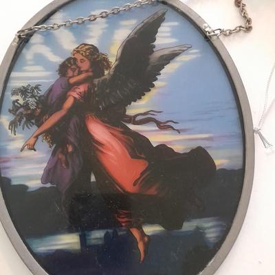 Stained glass window hangings and a small God bless the birds Tapestry.