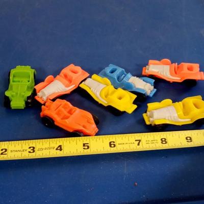 LOT 116  SEVEN PLASTIC CARS WITH A METAL BALL