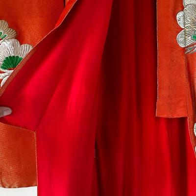 Beautiful red Japanese Uchikake ceremonial kimono featuring embroidered cranes.