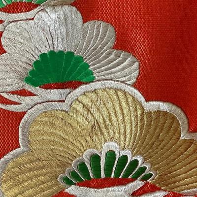 Beautiful red Japanese Uchikake ceremonial kimono featuring embroidered cranes.
