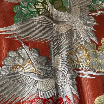Beautiful red Japanese Uchikake ceremonial kimono featuring embroidered cranes.