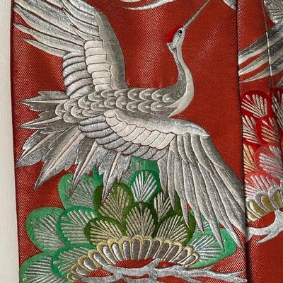 Beautiful red Japanese Uchikake ceremonial kimono featuring embroidered cranes.