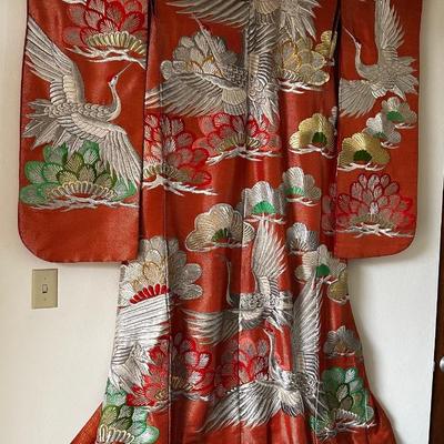Beautiful red Japanese Uchikake ceremonial kimono featuring embroidered cranes.