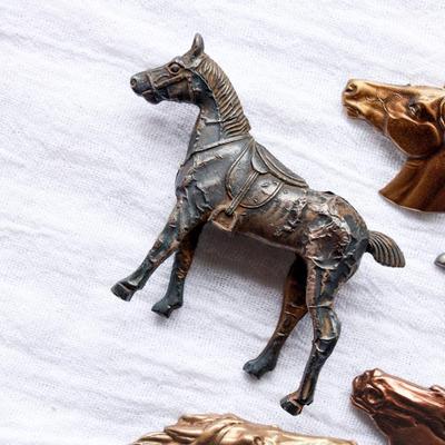 Unique vintage set of metal horse brooches