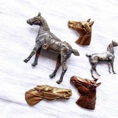Unique vintage set of metal horse brooches