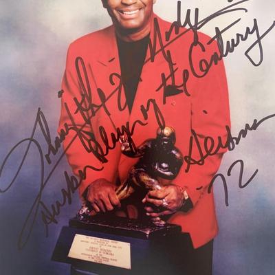Football player Johnny Rodgers signed photo.